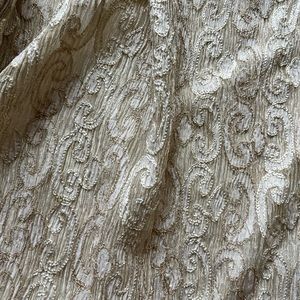 Fabric: TELIO and CIE Embroidered metallic tissue silk pleated fabric. 4.2 mts